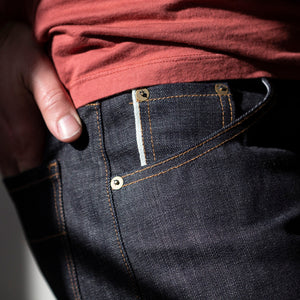 angle: 211 | A model wears Raleigh Denim Workshop Jones thin fit selvage raw jeans, front view